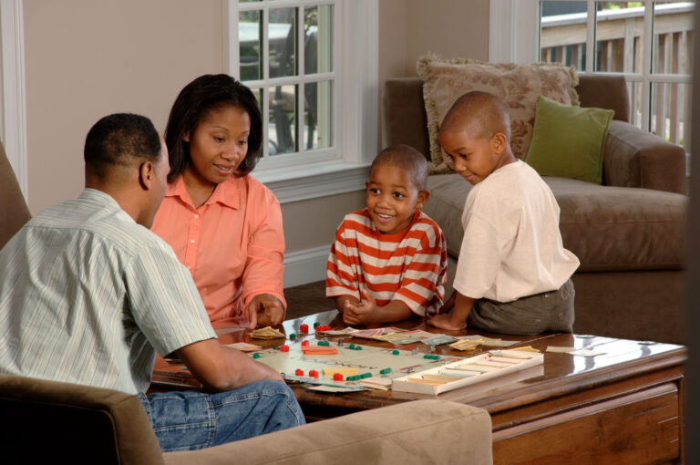 Family playing a board game